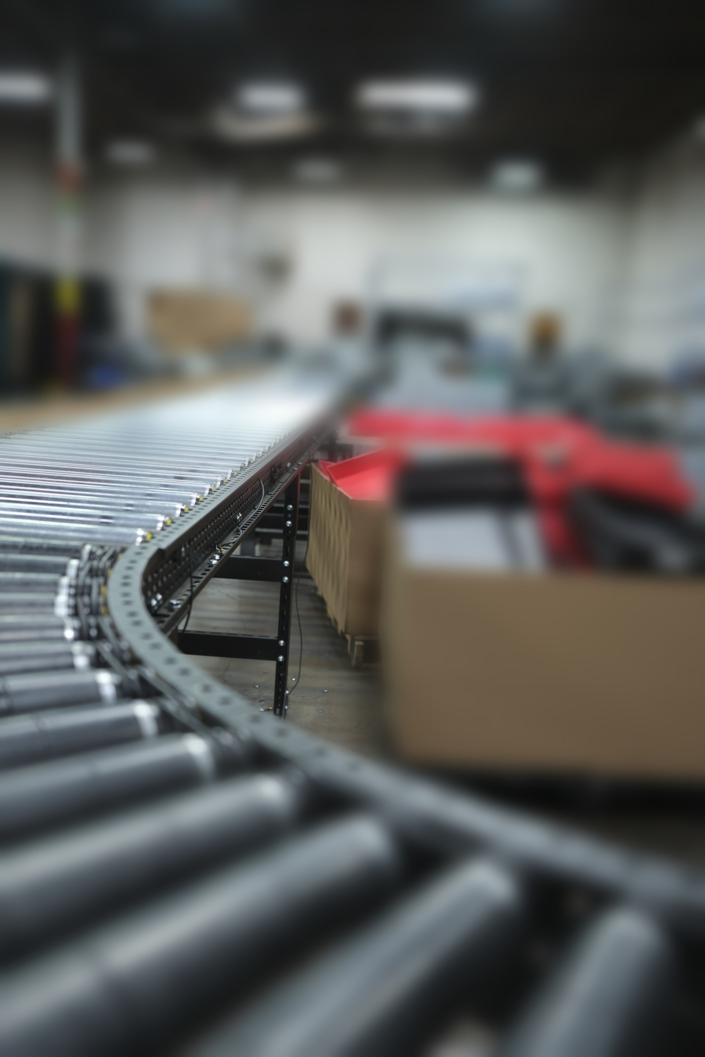 3C conveyor processing line — depth-of-field highlights the automation throughput